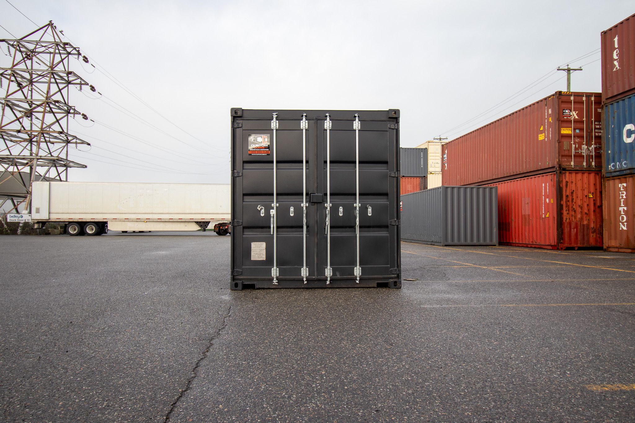 20’ New (1-trip) Container – Painted black - Custom Cubes