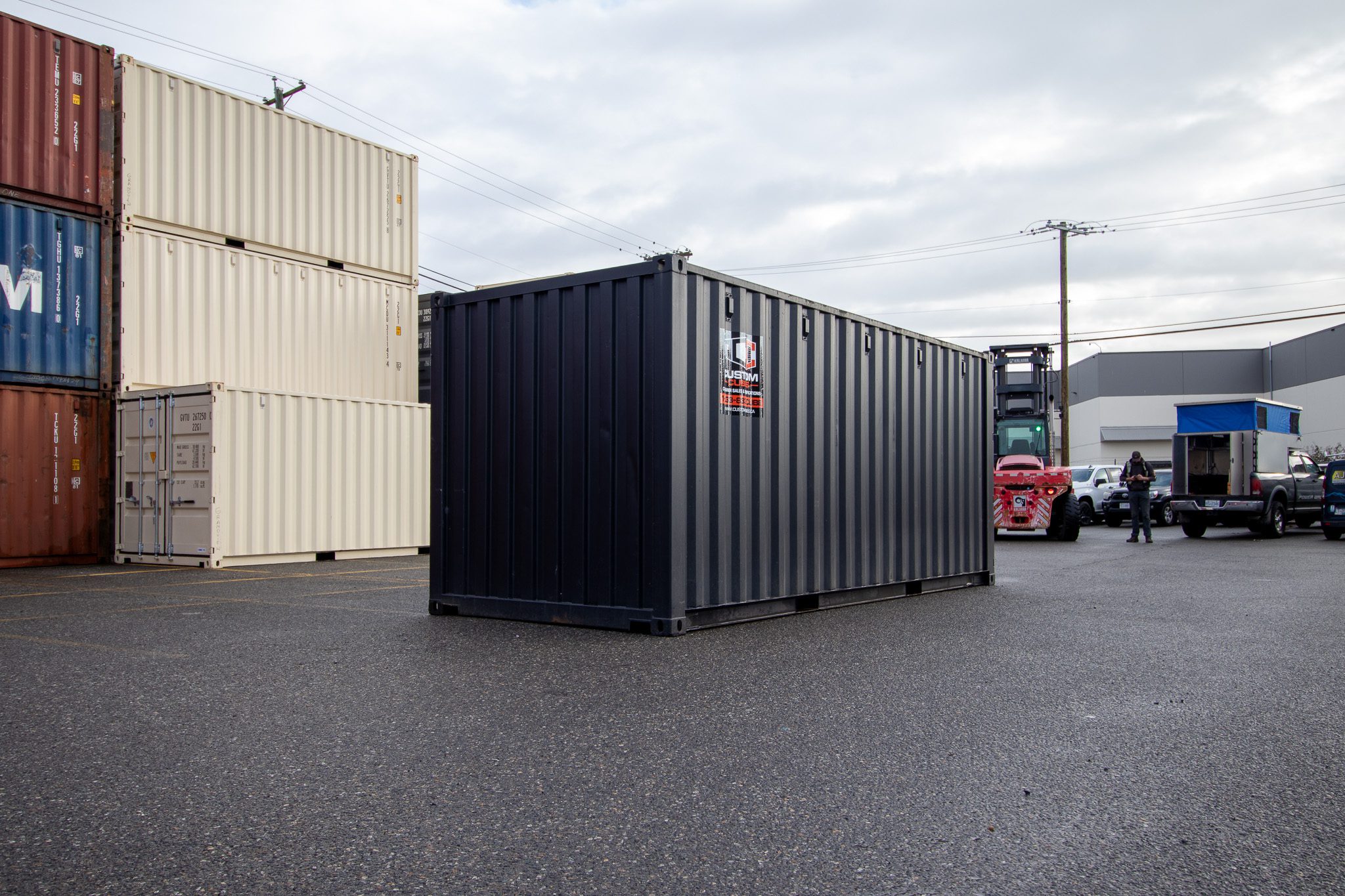 20’ New (1-trip) Container – Painted black - Custom Cubes