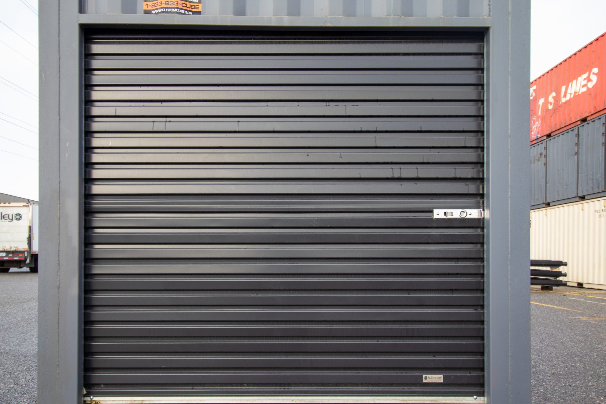 26′ Used Container with Roll up – Painted Grey - Custom Cubes